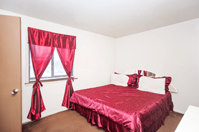 Bloomington apartment for rent - Bedroom at Henderson Court Apartments featuring a window.