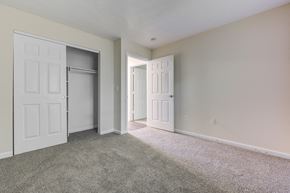 Brownsburg apartment for rent - Bedroom with a closet, white doors and a carpeted floor at Brownsburg Pointe.