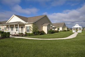 Noblesville apartment for rent - Side view of Meredith Meadows Apartments exterior with surrounding greenery.
