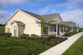 Noblesville apartment for rent - Front exterior of Meredith Meadows Apartments building with landscaped surroundings.