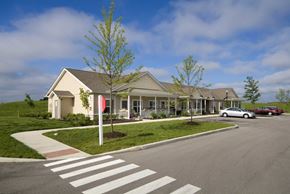 Noblesville apartment for rent - Exterior view of Meredith Meadows Apartments with parking lot.