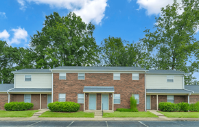 New Albany apartment for rent - Exterior view of a building at Valley Ridge Apartments with well-maintained landscaping.