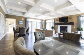 Zionsville apartment for rent - A living room with a fireplace and a glass table.