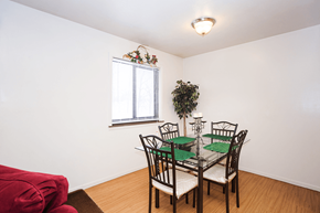 Bloomington apartment for rent - A dining room with a table set for four.