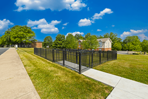 Bloomington apartment for rent - Dog park at Country View Apartments, featuring fenced grass areas for pets to enjoy and socialize.