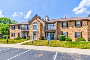 Indianapolis apartment for rent - Exterior view of Cedar Ridge Apartments with parking lot