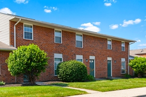 Indianapolis apartment for rent - Exterior view of Windsor Park Apartments, with landscaped grounds, and welcoming entryway.