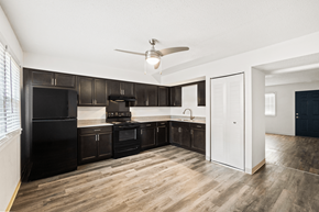 Bloomington apartment for rent - Kitchen in a 2-bedroom, 1-bathroom townhome at Country View Apartments, featuring appliances, spacious countertops, and cabinets.