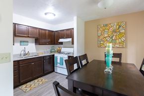 Mishawaka apartment for rent - a kitchen and dining room with a table and chairs