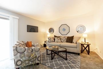 Mishawaka apartment for rent - a living room with a couch and chairs and a window