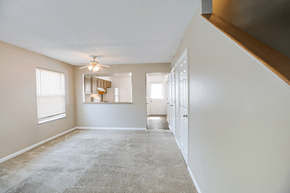 Louisville apartment for rent - Living room in a 2- or 3-bedroom townhome at Hampton Place Apartments, featuring a spacious layout and natural light.