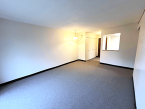 Kent apartment for rent - Open living and dining area in a one-bedroom, one-bathroom apartment at Kentwood Square Apartments.