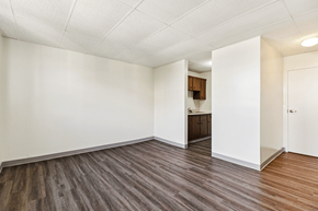 Lafayette apartment for rent - Living room and kitchen in a one-bedroom apartment at Fowler in Lafayette, IN.
