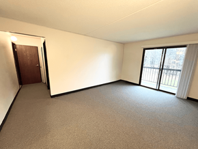 Kent apartment for rent - Living room with patio access in a one-bedroom, one-bathroom apartment at Kentwood Square Apartments.