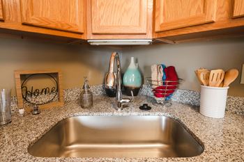 Updated kitchen sinks and faucets in newly renovated archer's pointe apartments