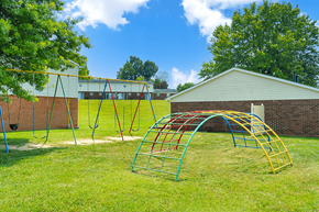 New Albany apartment for rent - Playground at Valley Ridge Apartments featuring colorful play structures, swings, and a play area.