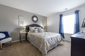 Mishawaka apartment for rent - a bedroom with a bed and a window