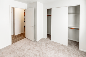 Michigan City apartment for rent - Secondary bedroom in a 2-bedroom, 1-bath apartment at Woodland Crossing, featuring neutral walls and carpeted flooring.