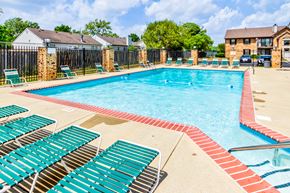Indianapolis apartment for rent - Swimming pool with seating at Cedar Ridge Apartmenrts