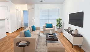 Greenville apartment for rent - A living room with a couch, a chair, a coffee table, and a television.