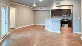 Palestine apartment for rent - A kitchen area with a white refrigerator and a microwave.