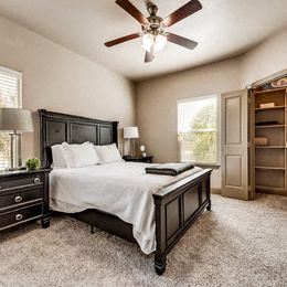Mount Pleasant apartment for rent - a bedroom with a large bed and a ceiling fan at Cypress Creek Apartments