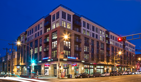 Seattle apartment for rent - Contemporary brick building exterior at twilight at The Lyric Apartments, Seattle, WA 98102