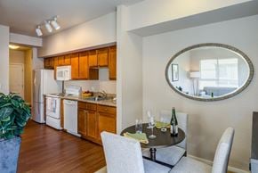 Seattle apartment for rent - Kitchen and dining area with wood cabinetry at The Corydon Apartments, Seattle