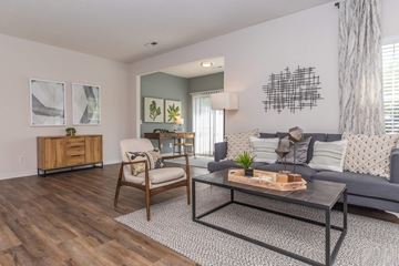 Aurora apartment for rent - a living room with a couch and a table