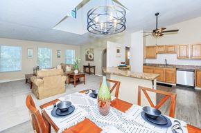 Aurora apartment for rent - A dining room with a table set for two.