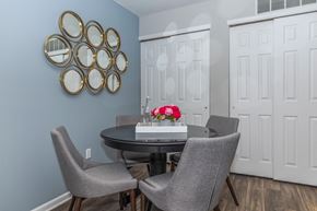 Streetsboro apartment for rent - a dining room with a table and chairs and blue walls