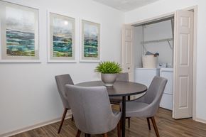 Sagamore Hills apartment for rent - A dining room with a table and chairs and a potted plant.
