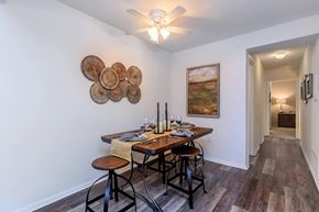 Lynchburg apartment for rent - a dining room with a table and chairs and a ceiling fan