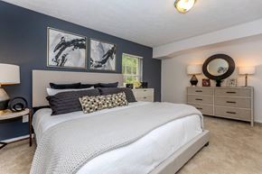 Medina apartment for rent - a bedroom with blue walls and a white bed
