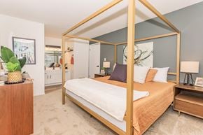 Hales Corners apartment for rent - a bedroom with a bed in a gold canopy