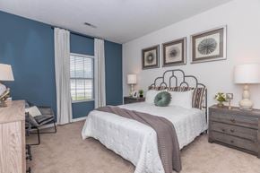 Aurora apartment for rent - a bedroom with a bed and a window