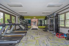 Avon apartment for rent - a gym with treadmills and weights in a room with windows