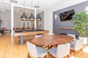 Southfield apartment for rent - a dining room with a table and chairs and a pool table