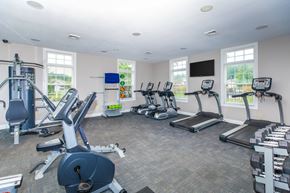 Sheffield Lake apartment for rent - A gym with treadmills, elliptical machines, and other exercise equipment.