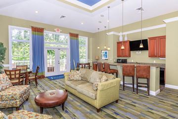 Kent apartment for rent - a living room and kitchen with a couch and a table