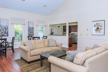 Aurora apartment for rent - A living room with a beige couch and a glass coffee table.