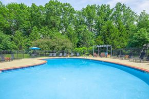 Avon apartment for rent - a large swimming pool with trees in the background