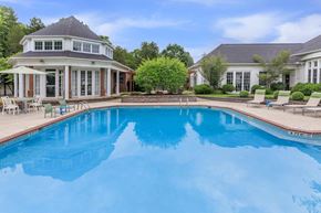 Avon apartment for rent - a swimming pool in front of a home with a resort style pool