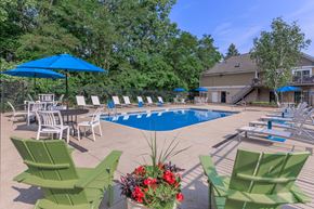 Medina apartment for rent - a swimming pool with chairs and umbrellas and a house