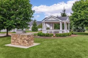 Streetsboro apartment for rent - a gazebo in the middle of a lawn with trees and a statue