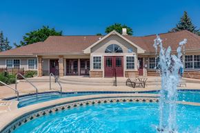 Hales Corners apartment for rent - a swimming pool with a house in the background