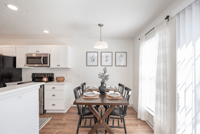Medina townhouse for rent - A dining room with a table set for a meal.