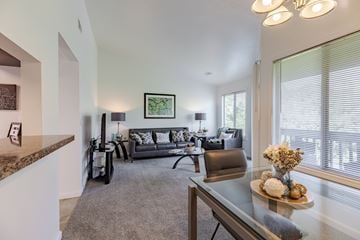 Clarkston apartment for rent - A living room with a grey couch and a coffee table.