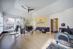 Lilitz townhouse for rent - A gym with a variety of equipment including a treadmill, rowing machine, and weights at Highlands at Warwick Apartments, Lilitz, PA
