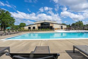 Troy apartment for rent - A pool with a building behind it.